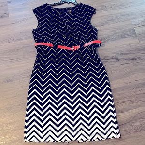 Black & white chevon style design sleeveless dress with pink belt. Super cute.